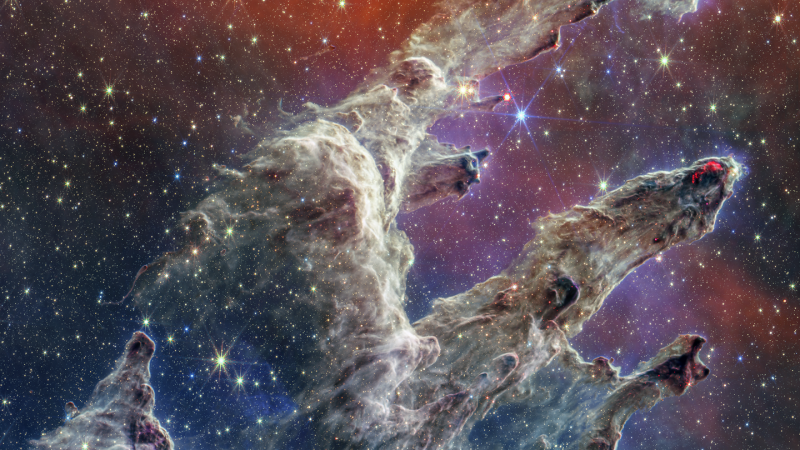 Pillars of Creation: By combining images of the iconic Pillars of Creation from two cameras aboard NASA’s James Webb Space Telescope, the universe has been framed in its glory. The pillars are the vast clouds of dust and gas in the foreground that swirl around and form celestial bodies.